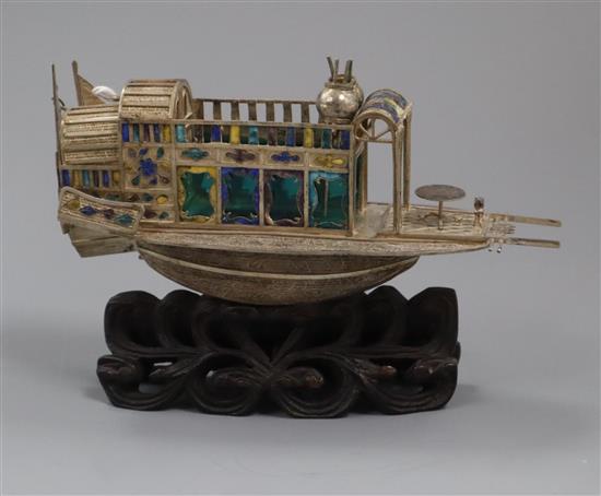 A Chinese white metal and enamel model of a junk, on hardwood stand, 14.5cm.